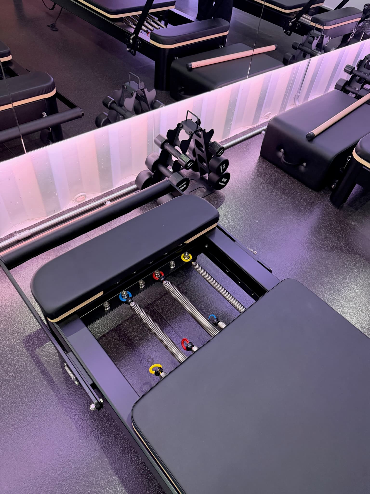 Reformer pilates equipment in use